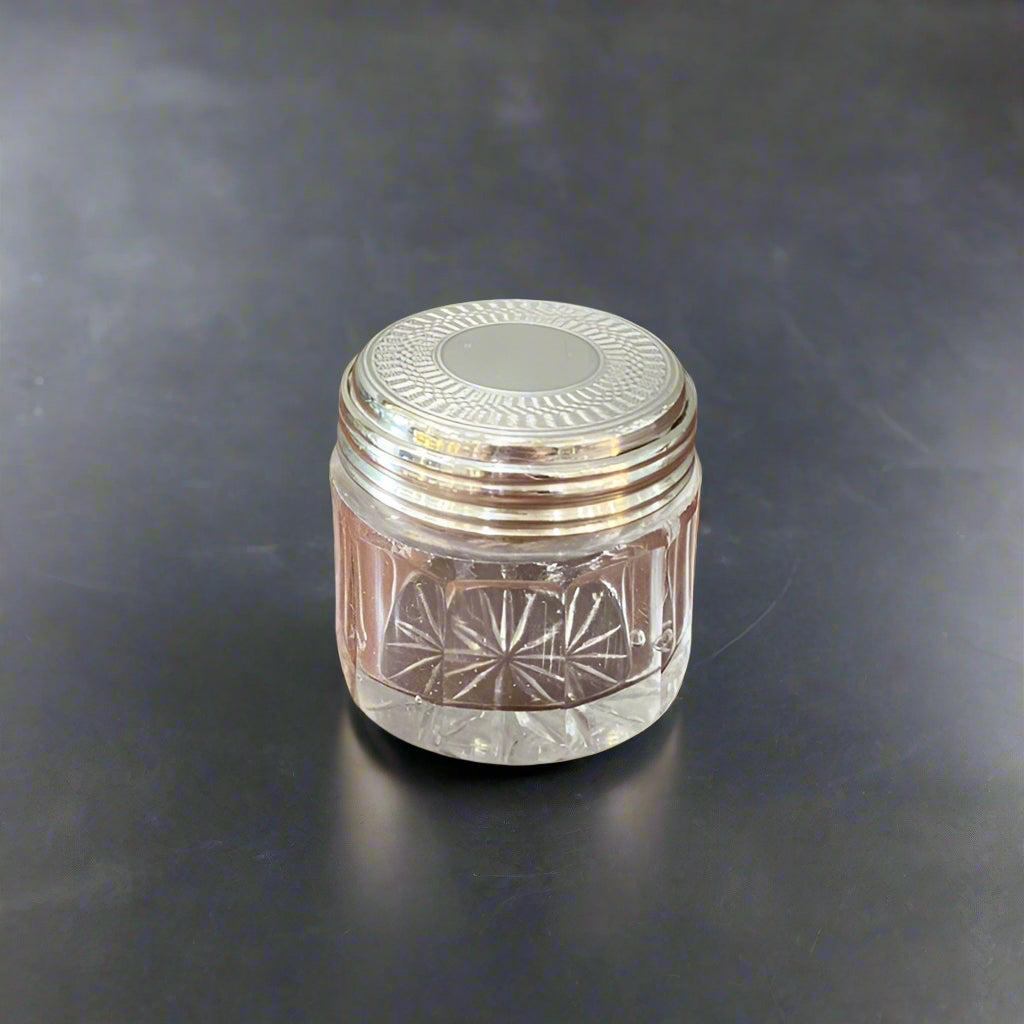 Unmarked dressing table jar with engine turned silver top circa 1930