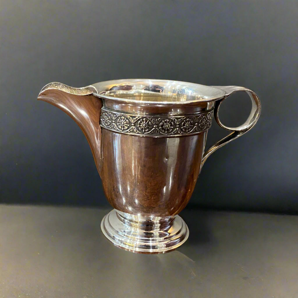 Silver cream jug with floral border made in Birmingham 1930 by Jones & Crompton