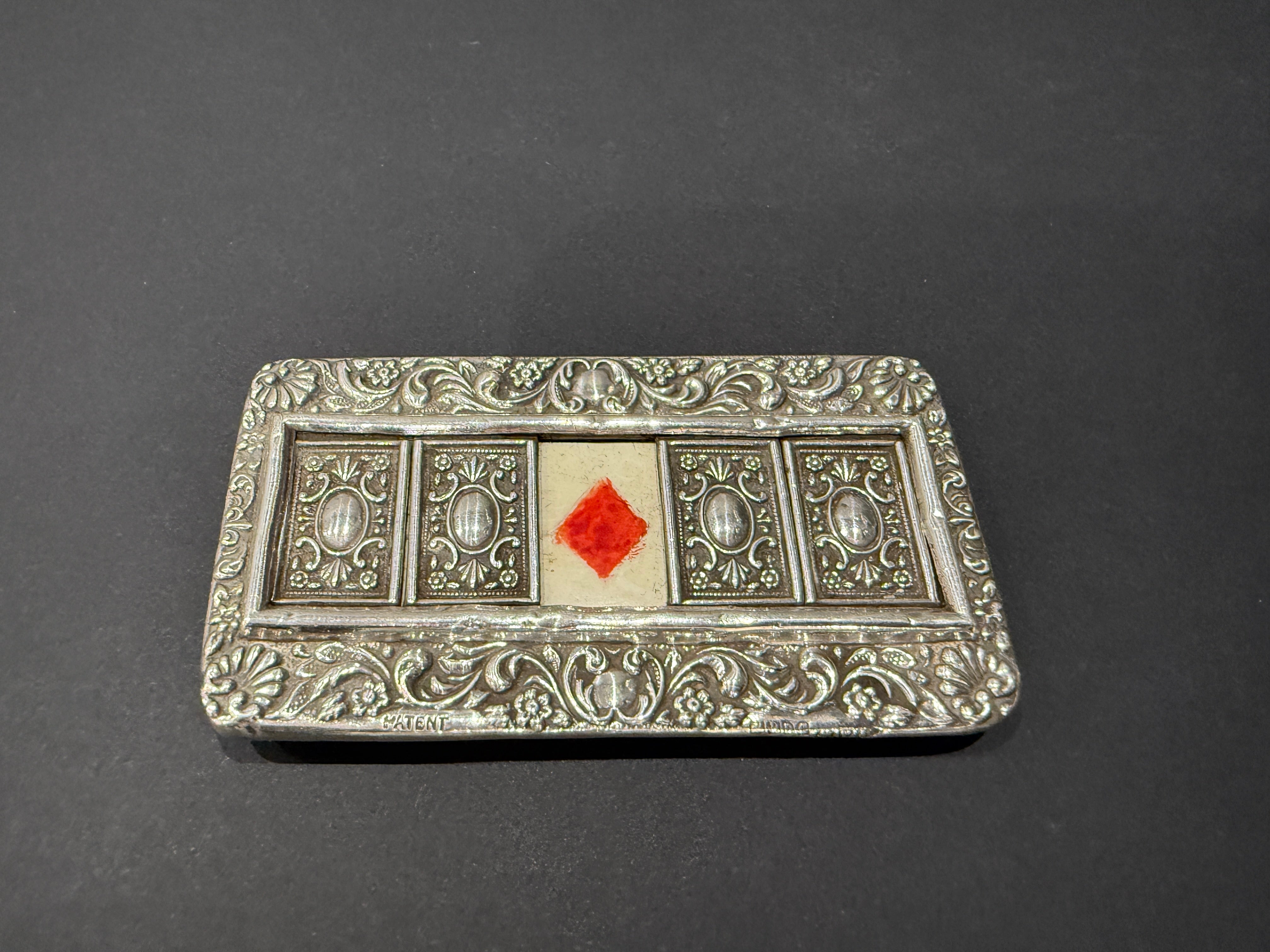 Heavily embossed small five window silver bridge trump marker mounted on wood made in Chester 1905