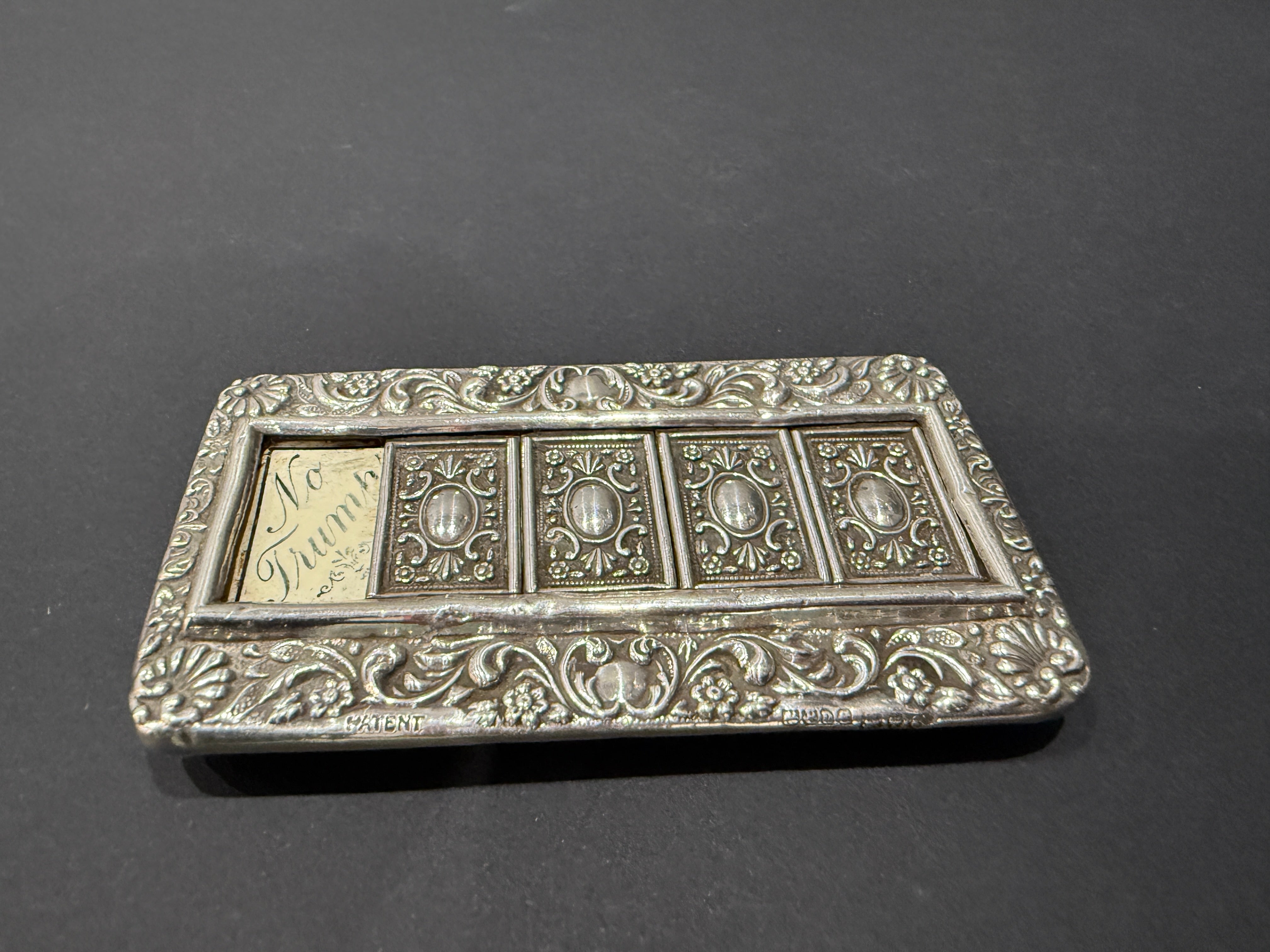 Heavily embossed small five window silver bridge trump marker mounted on wood made in Chester 1905