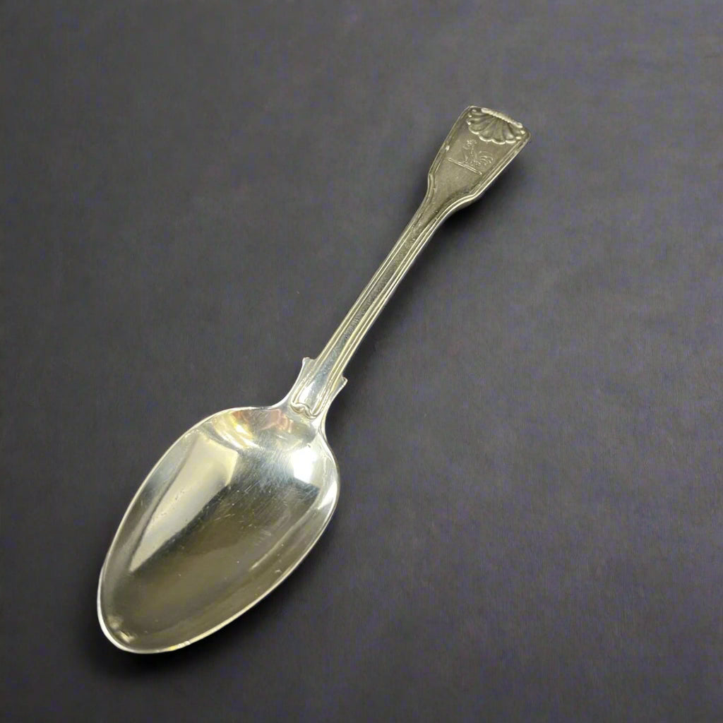 Silver fiddle, thread and shell dessert spoon made in London 1818 by Paul Storr