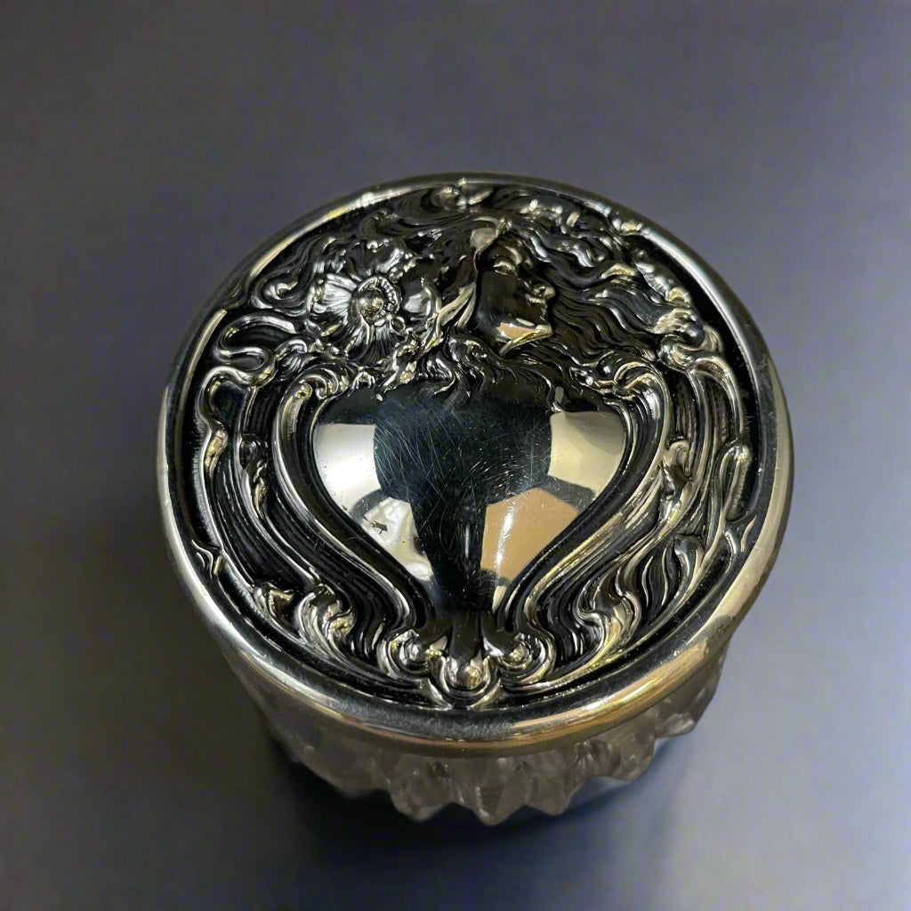 Sterling silver dressing table jar with Reynolds Angel style embossed lid with vacant heart shape escutcheon made in America circa 1920