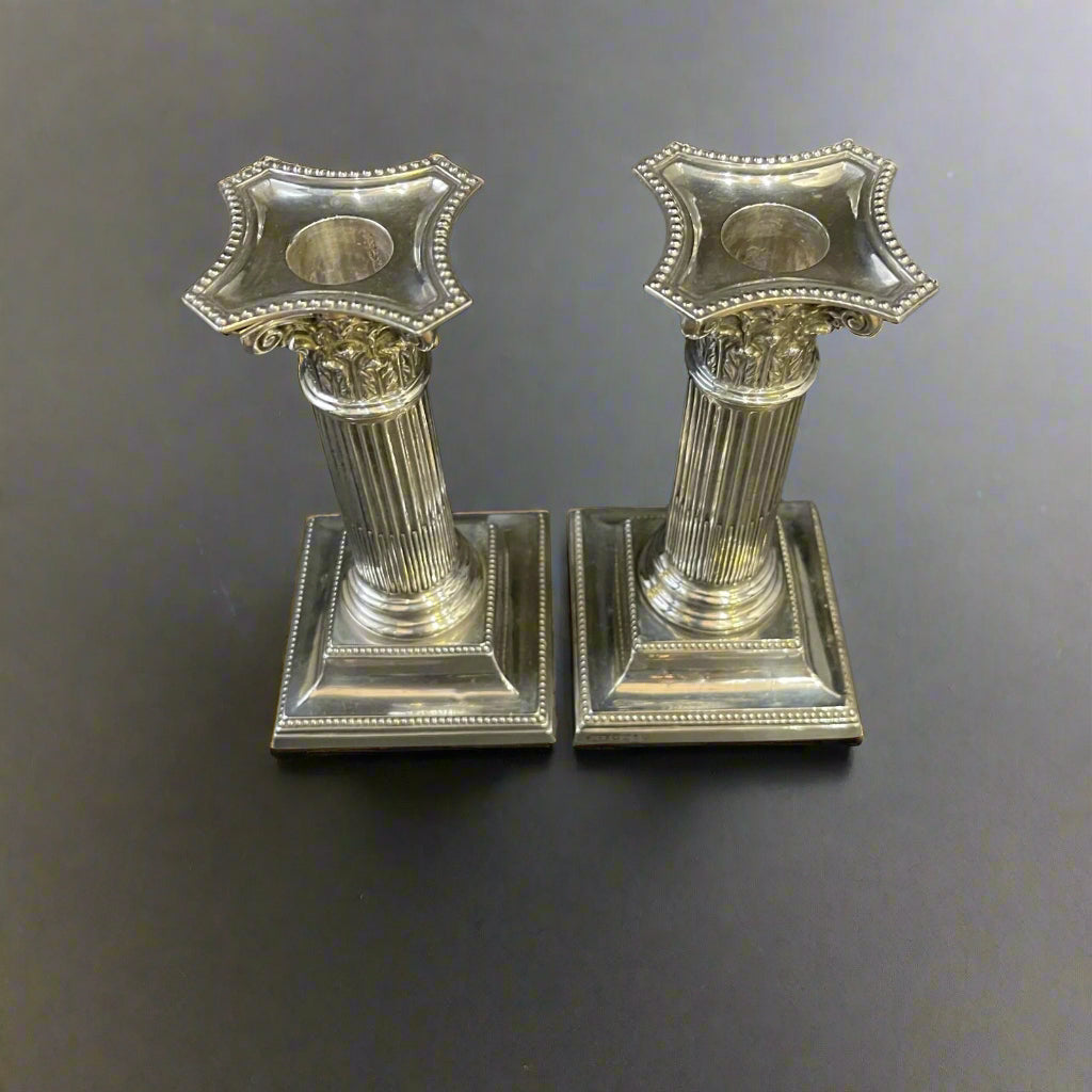 Pair of silver dwarf Corinthian column candlesticks mad ein Sheffield 1887 by Hawkswroth and Eyre