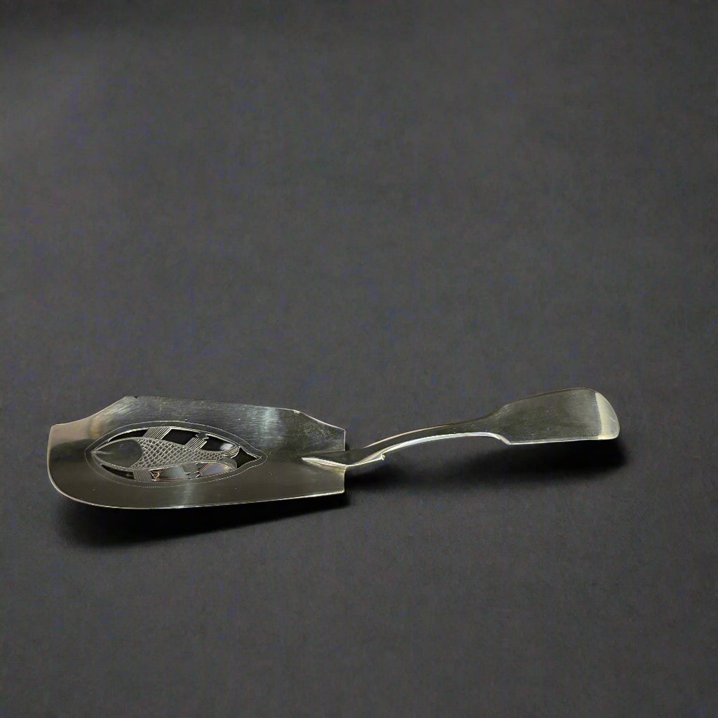 Silver fish server with an outline of a salmon in the main body made in Exeter 1815 by William Walch II 
