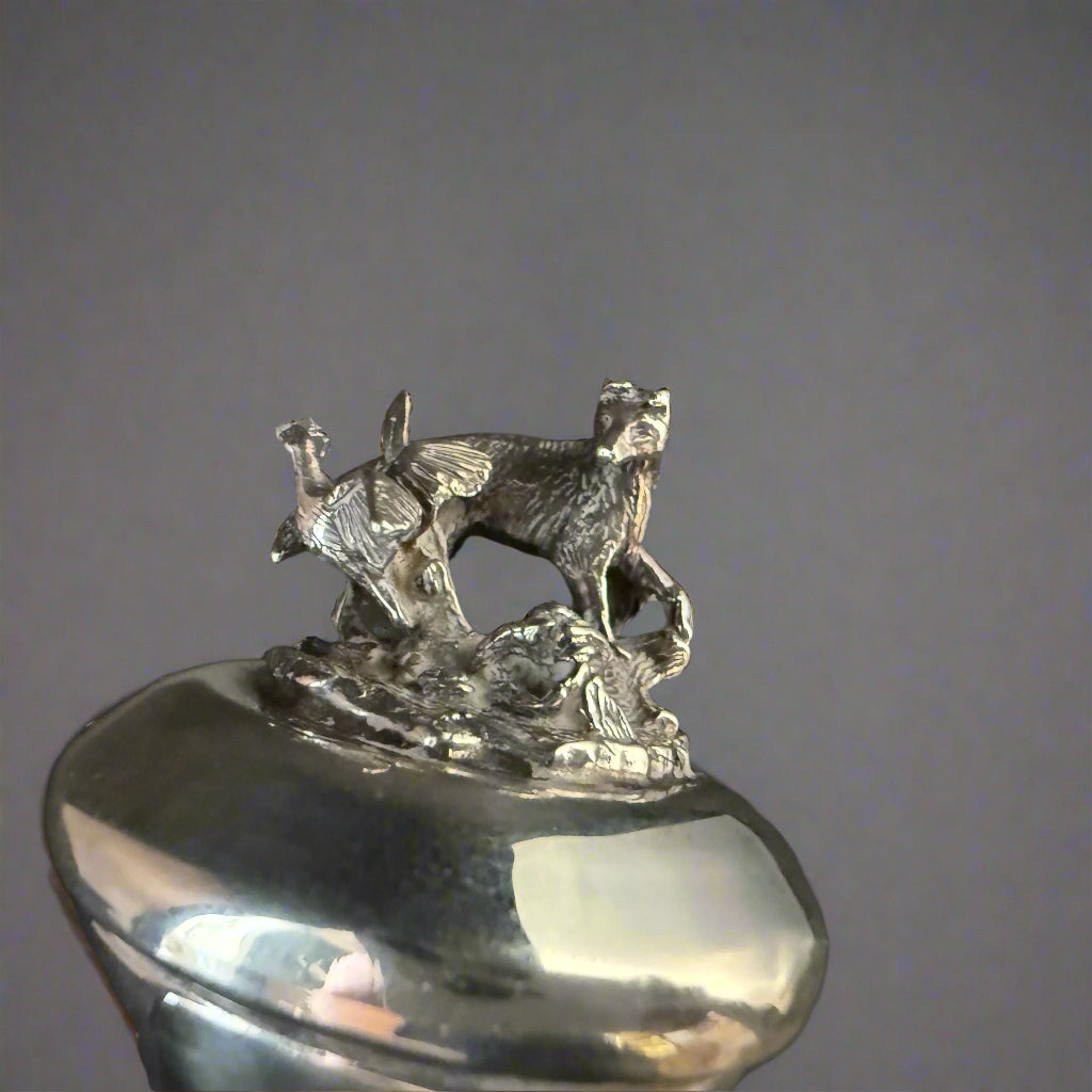 Silver topped bottle stopper decorated with a dog chasing a grouse made in Birmingham 1998