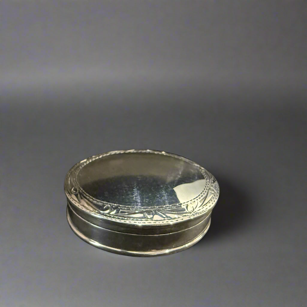 Modern oval silver pill box with bright cut rim made in Sheffield 2004