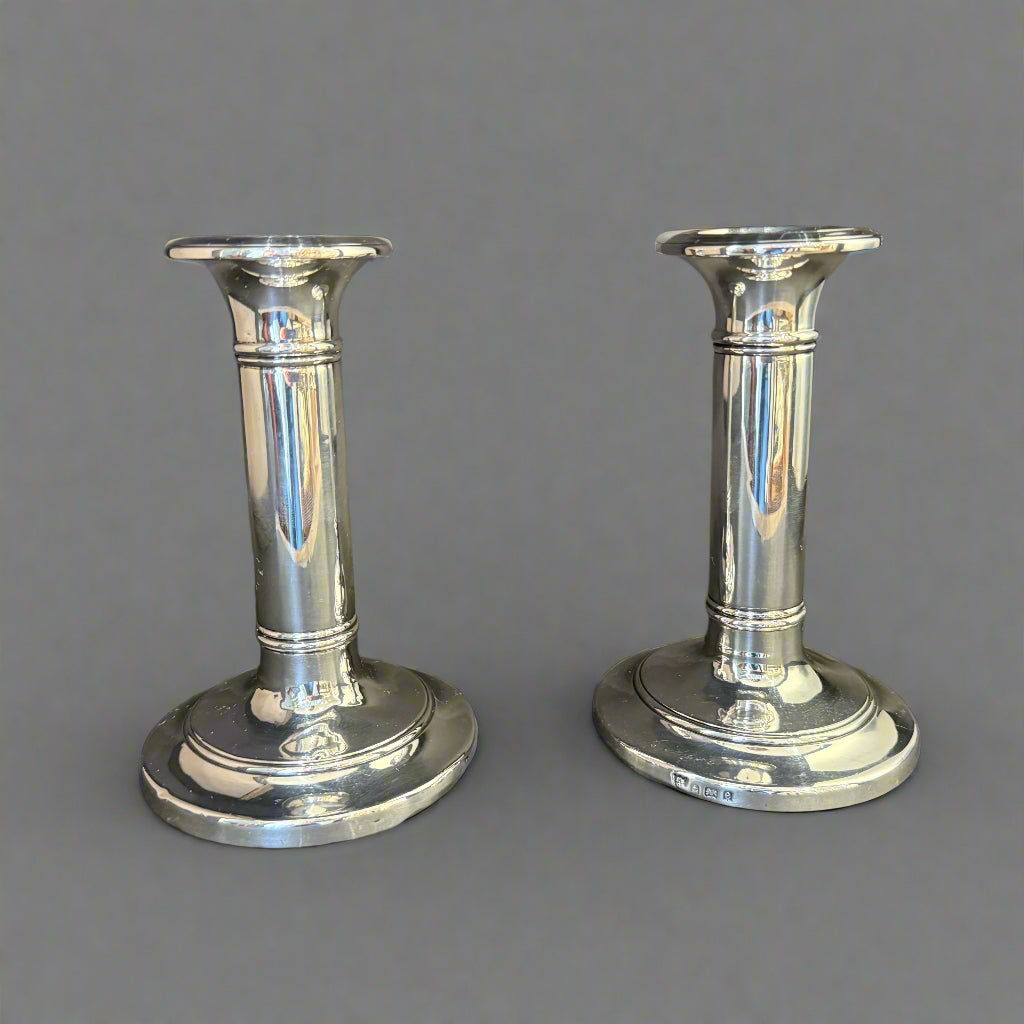 Pair of semi-dwarf silver candlesticks on round base made in Birmingham 1904 by IS Greenberg & Co
