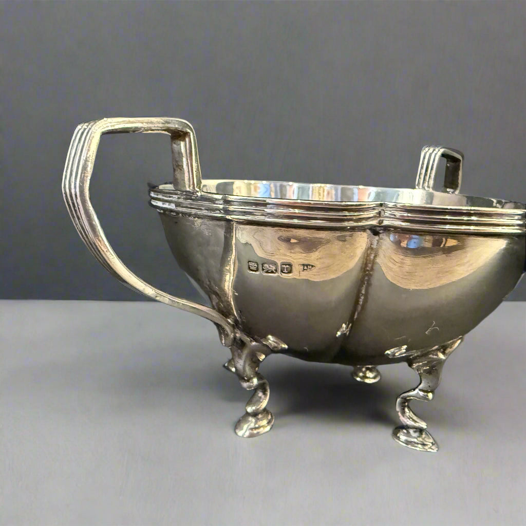 Two-handled petal shaped silver sugar basket made in Sheffield 1909 by Walker and Hall 