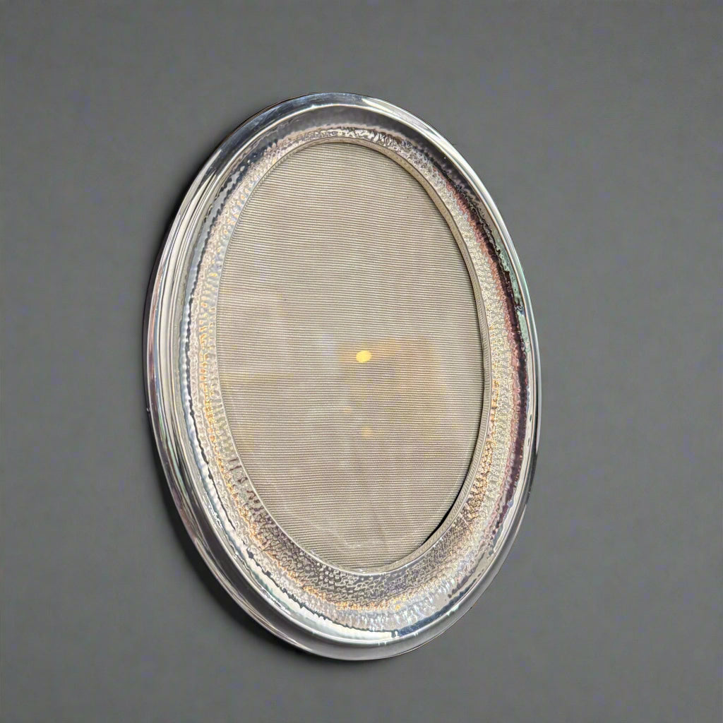 5x4" oval hand planished silver frame made in Birmingham 1915 by Saunders and Shepherd