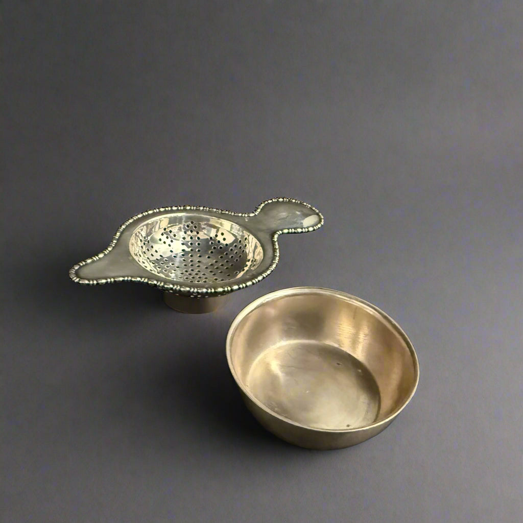 Bead-edged silver tea strainer and bowl made in Sheffield 1937 by Atkin Bros