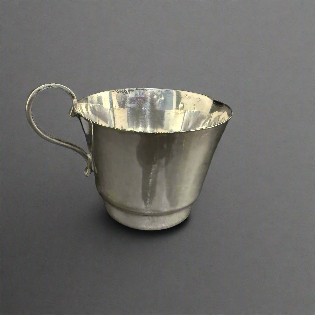 Silver cream jug possibly made by Thomas Warner & Co of Baltimore USA 