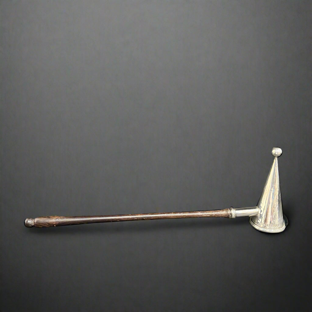 Modern silver candle snuffer with ebony handle made in London 