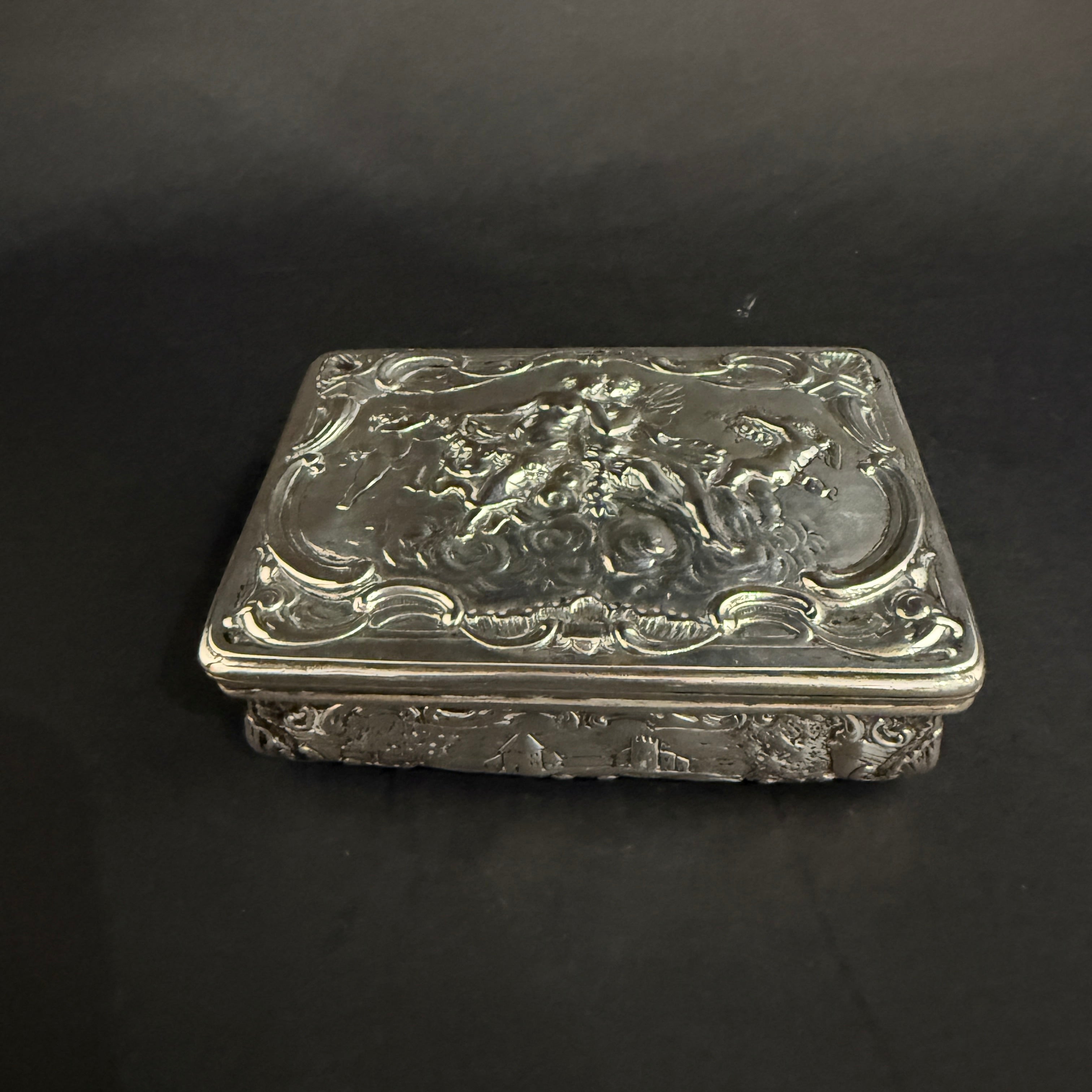 Dutch silver trinket box with green velvet interior and repousee decorations circa 1820