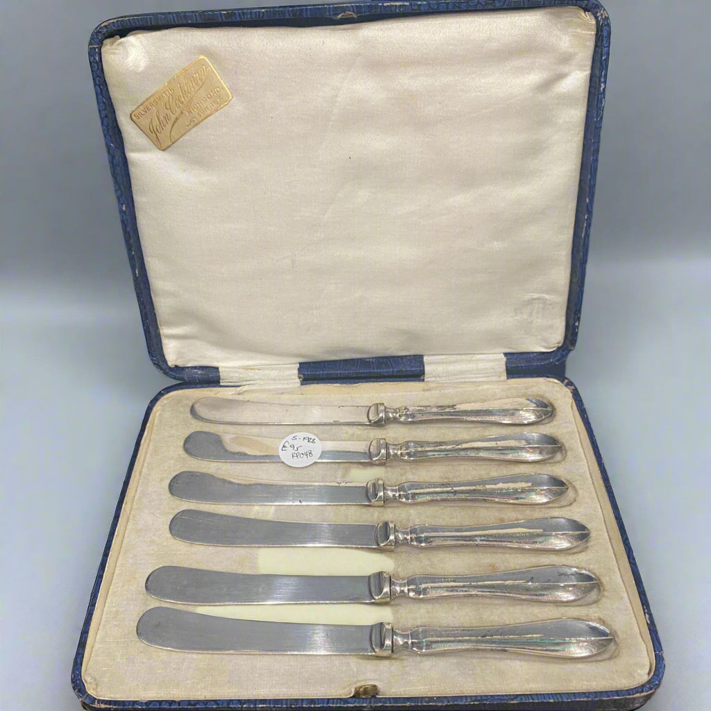 Boxed set of silver butter knives 1928