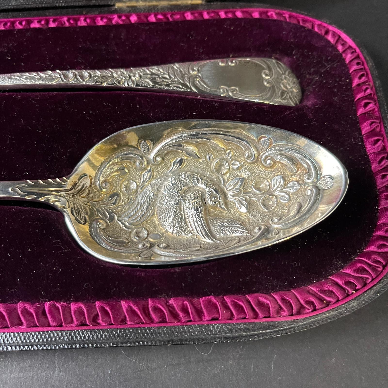 Boxed pair of heavily embossed silver berry spoons made in London 1803 by Thomas Wallis II 