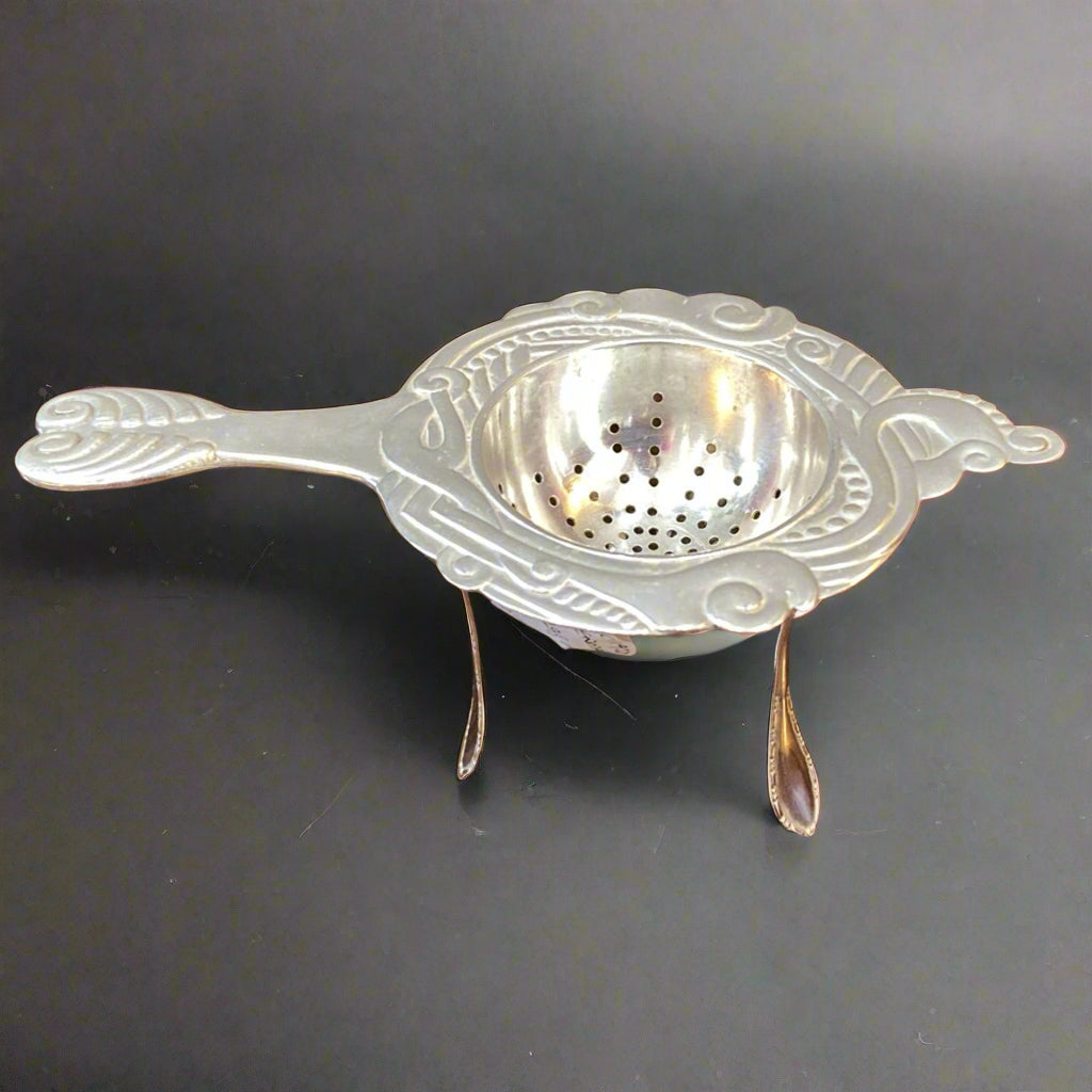 Silver tea strainer in Art Nouveau style made in Denmark circa 1920 by Christian Heise