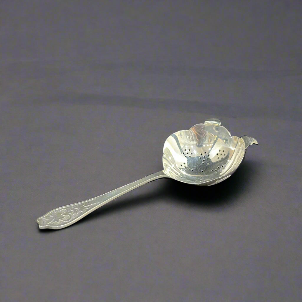 Silver tea strainer by Viners. Sheffield 1961