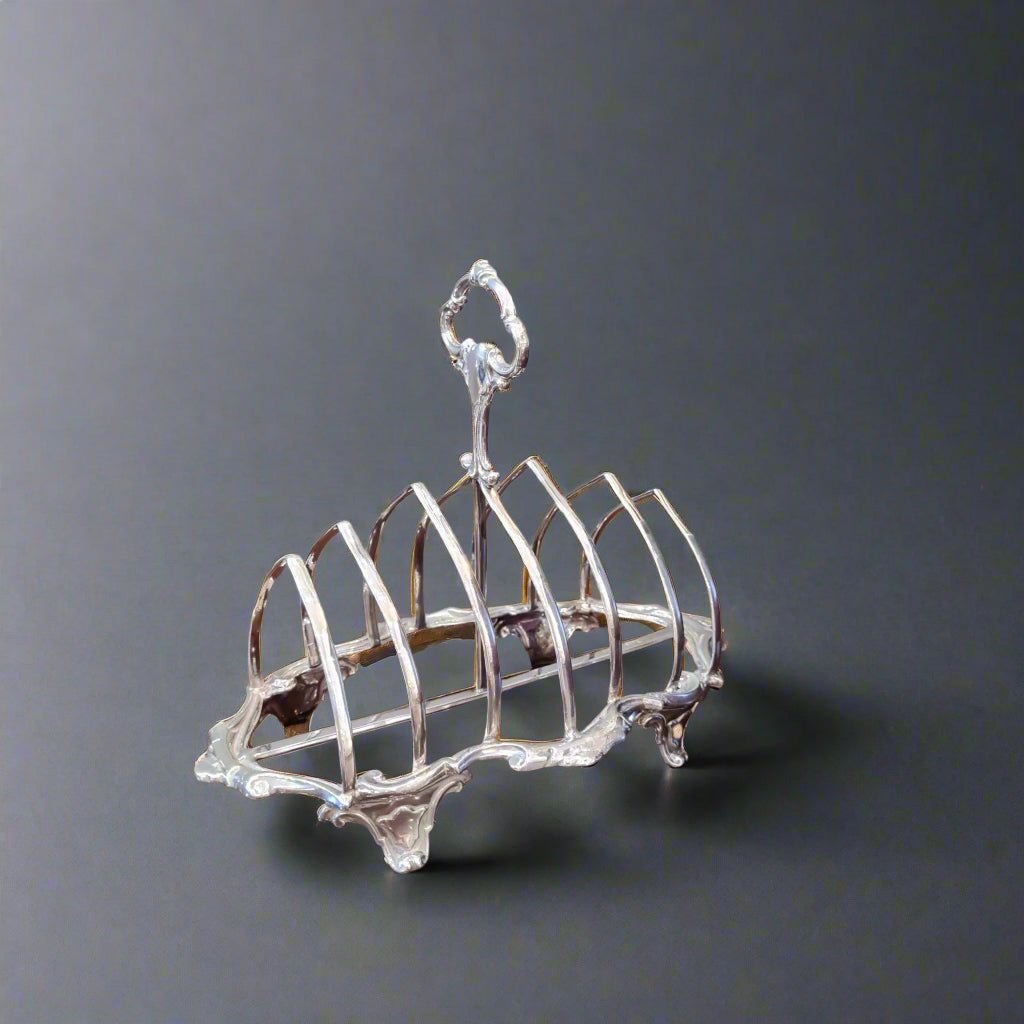 Six-bar curved silver toast rack with decorative handle made in London 1942 by Robert Pringle & Sons