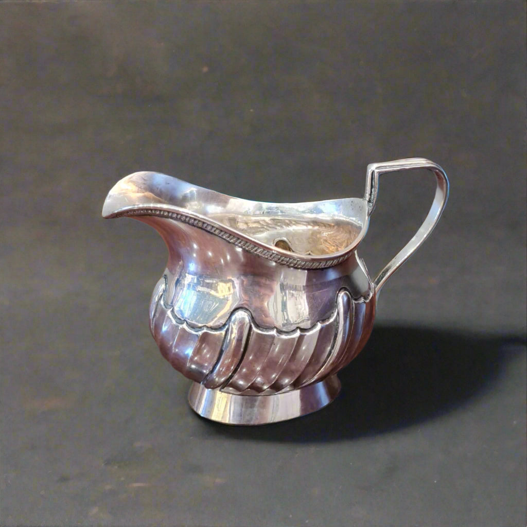 Silver fluted cream jug made in Birmingham 1890 by Hayes Brothers