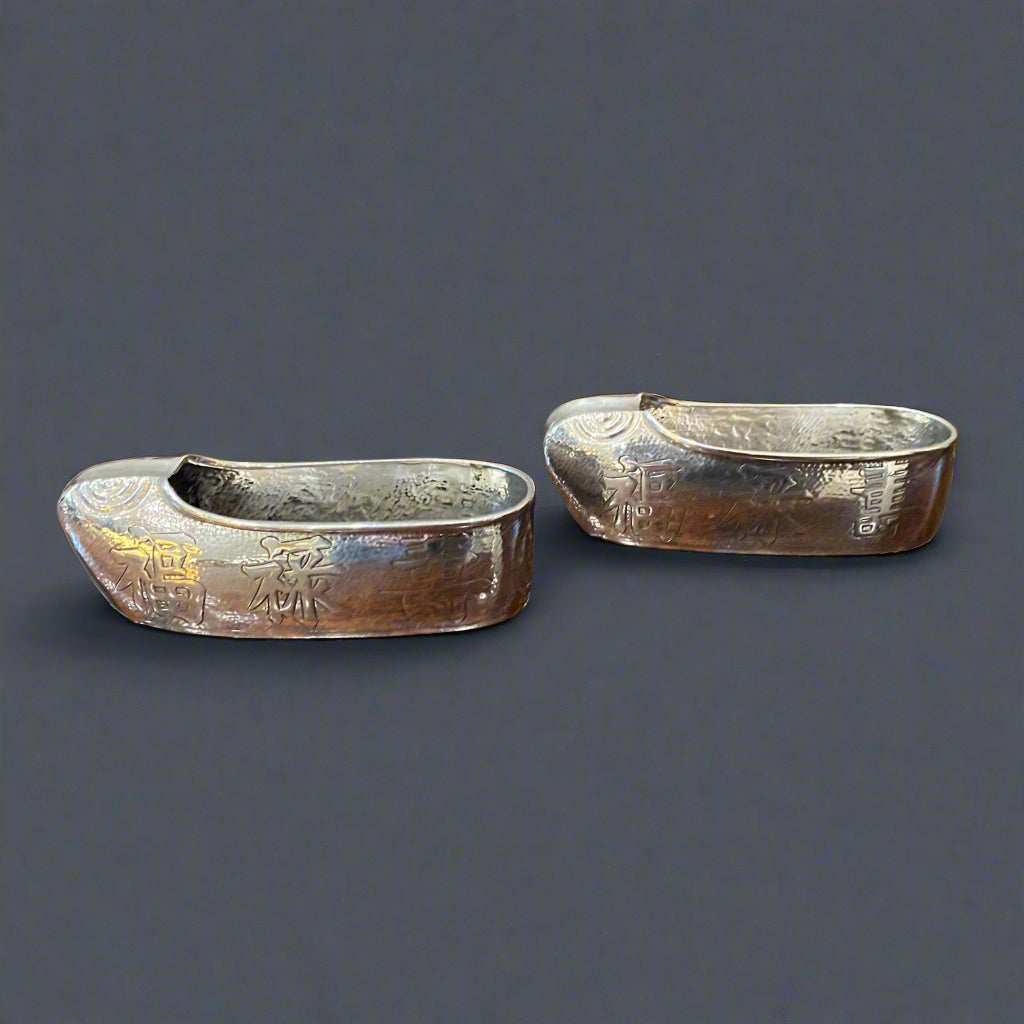 pair of hand hammered silver clogs made in Hong Kong by Wai Kee