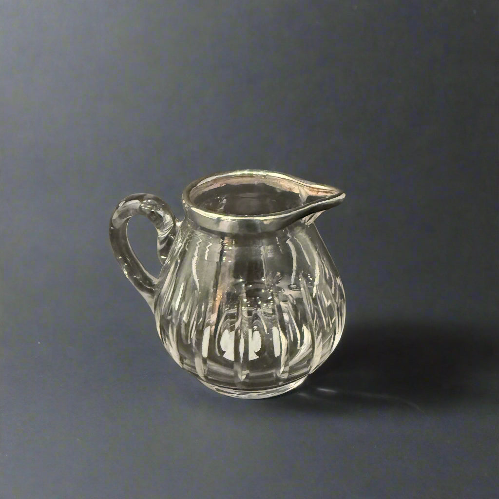 silver topped water jug 