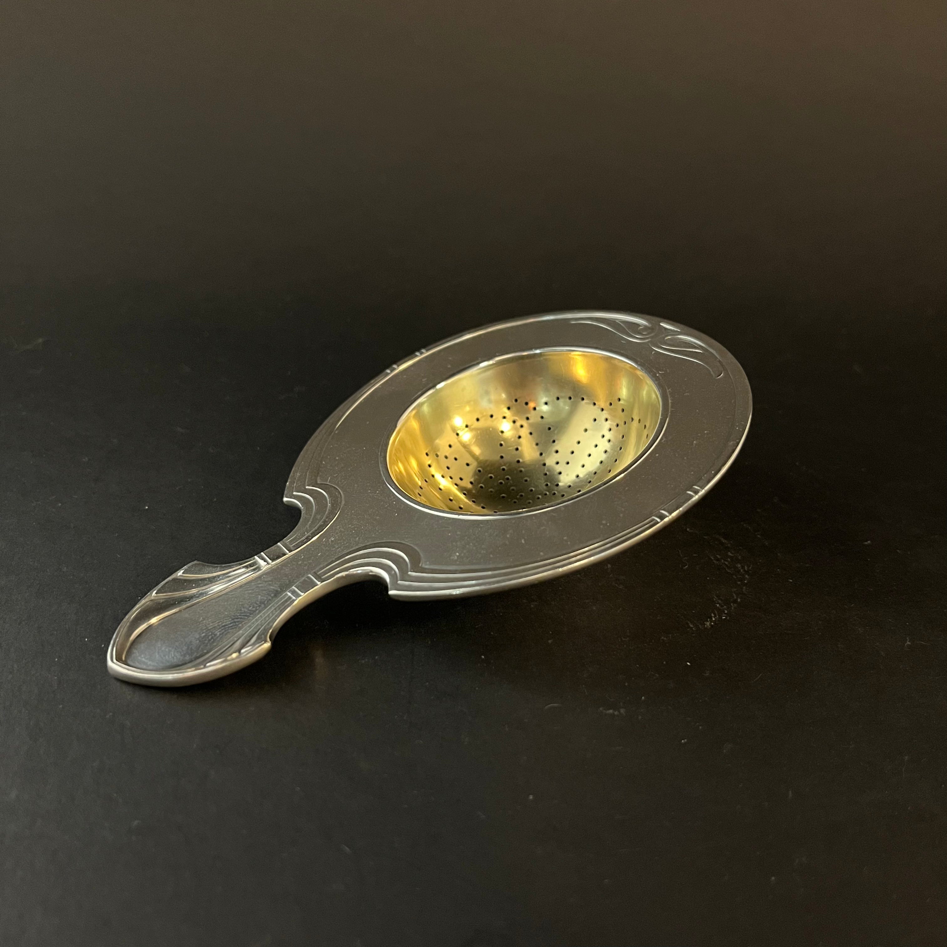 silver gilt tea strainer