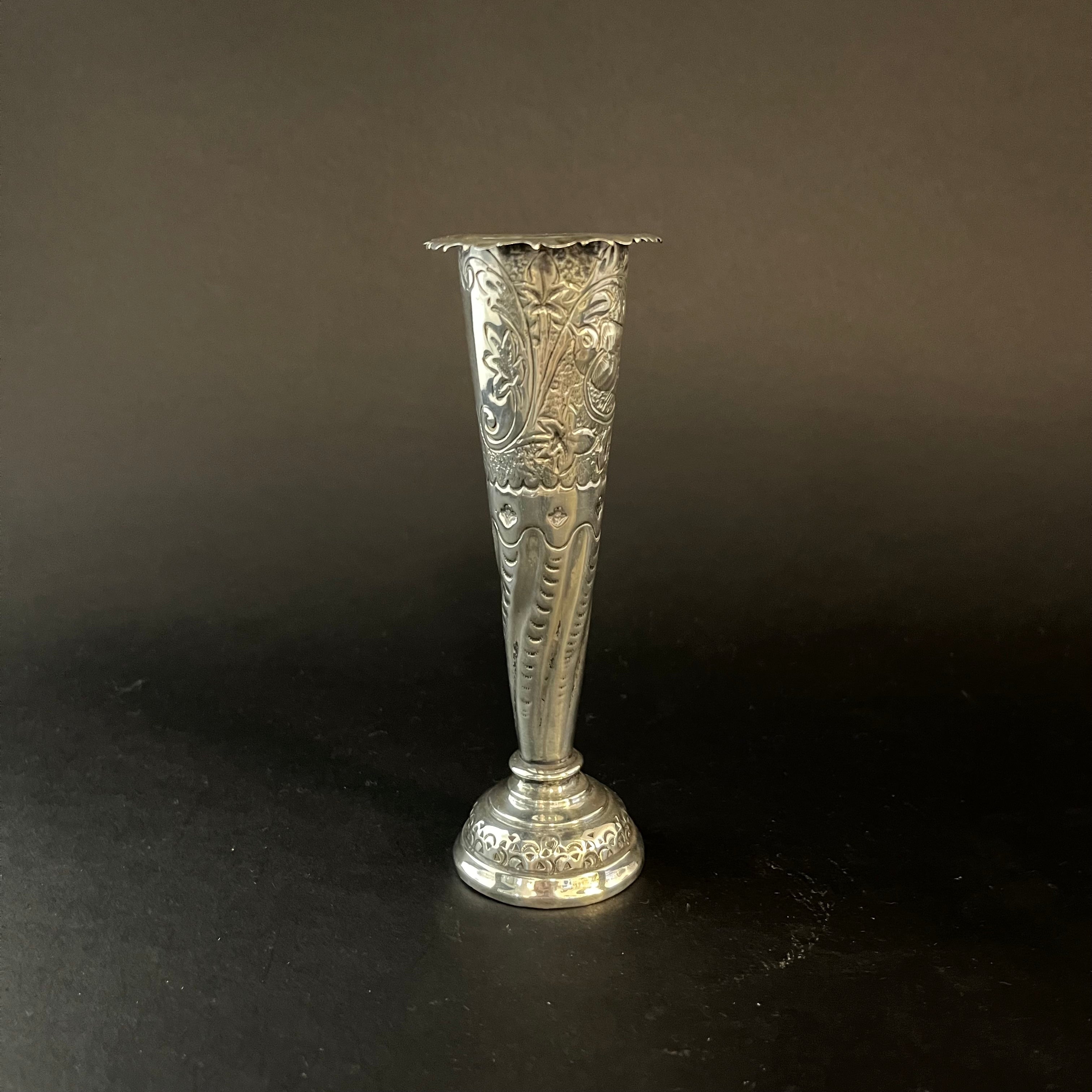 Silver bud vase with ornate chasse work made in London in 1887 by William Coymns