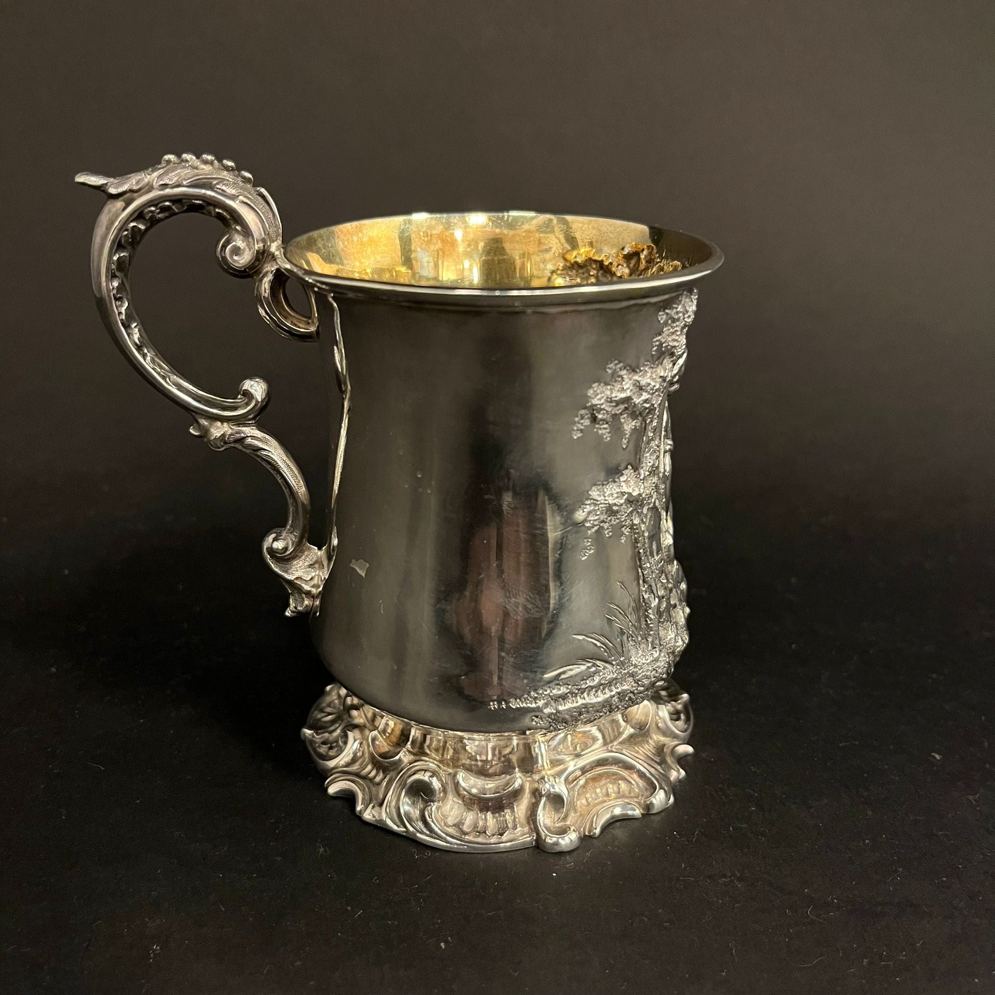 Silver christening mug with beautifully embossed scene of a boy and dog in a forest made in London in 1852 by Thomas Creswick