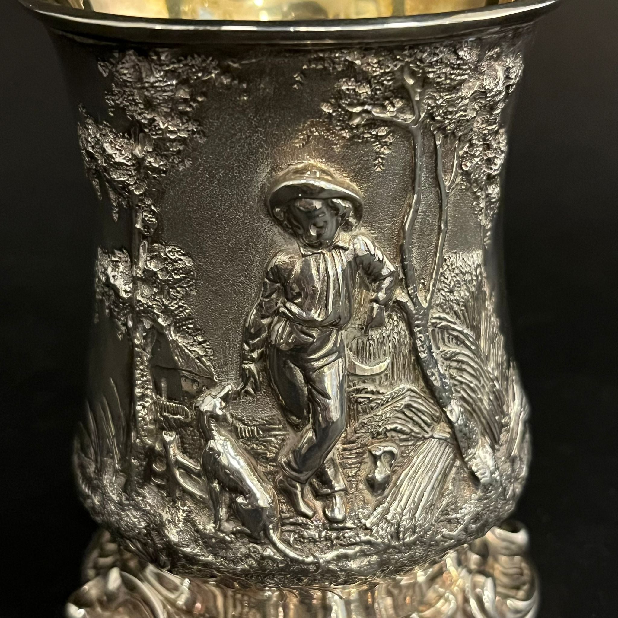 Silver christening mug with beautifully embossed scene of a boy and dog in a forest made in London in 1852 by Thomas Creswick