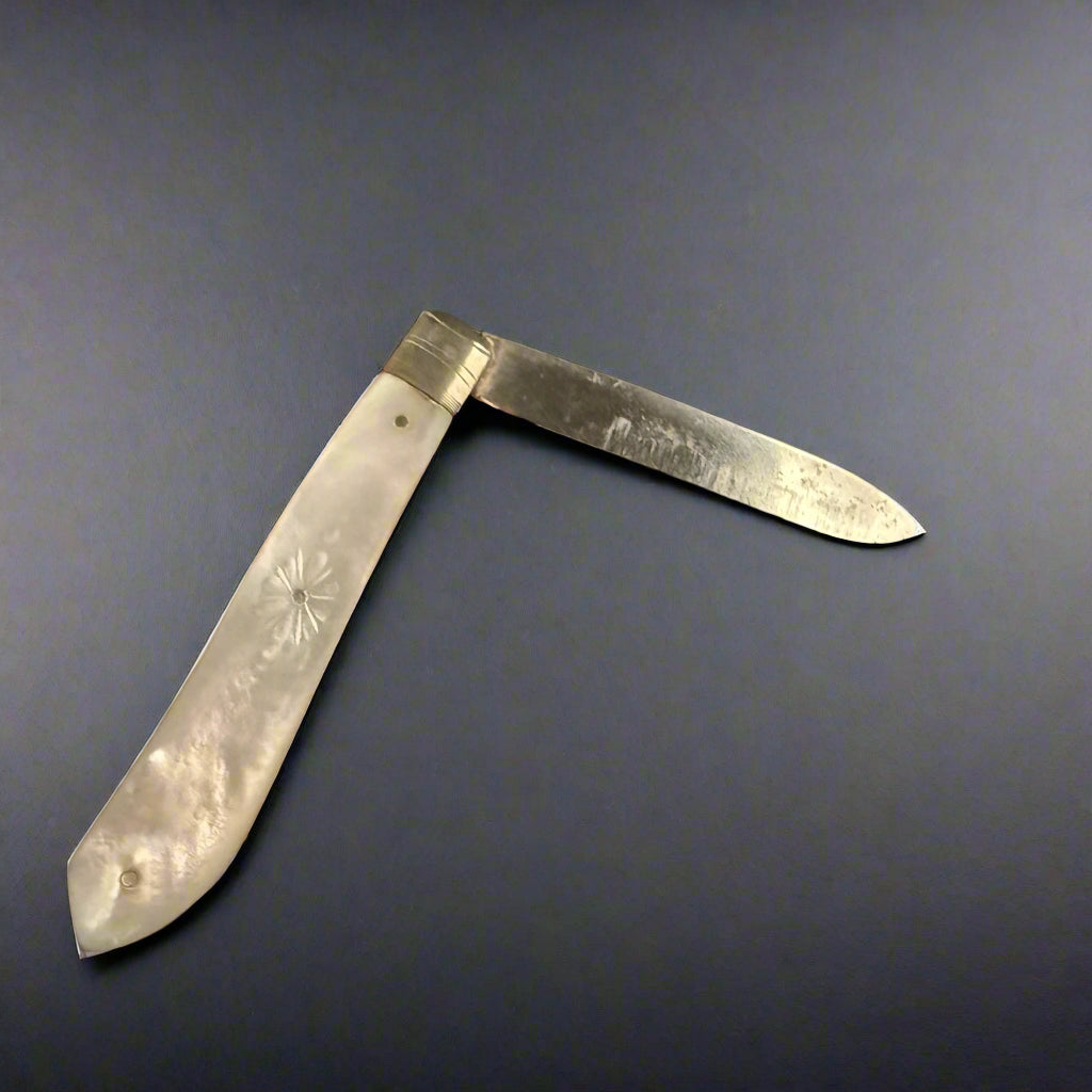 Small mother of pearl and silver bladed pocket knife made in Sheffield 1900 