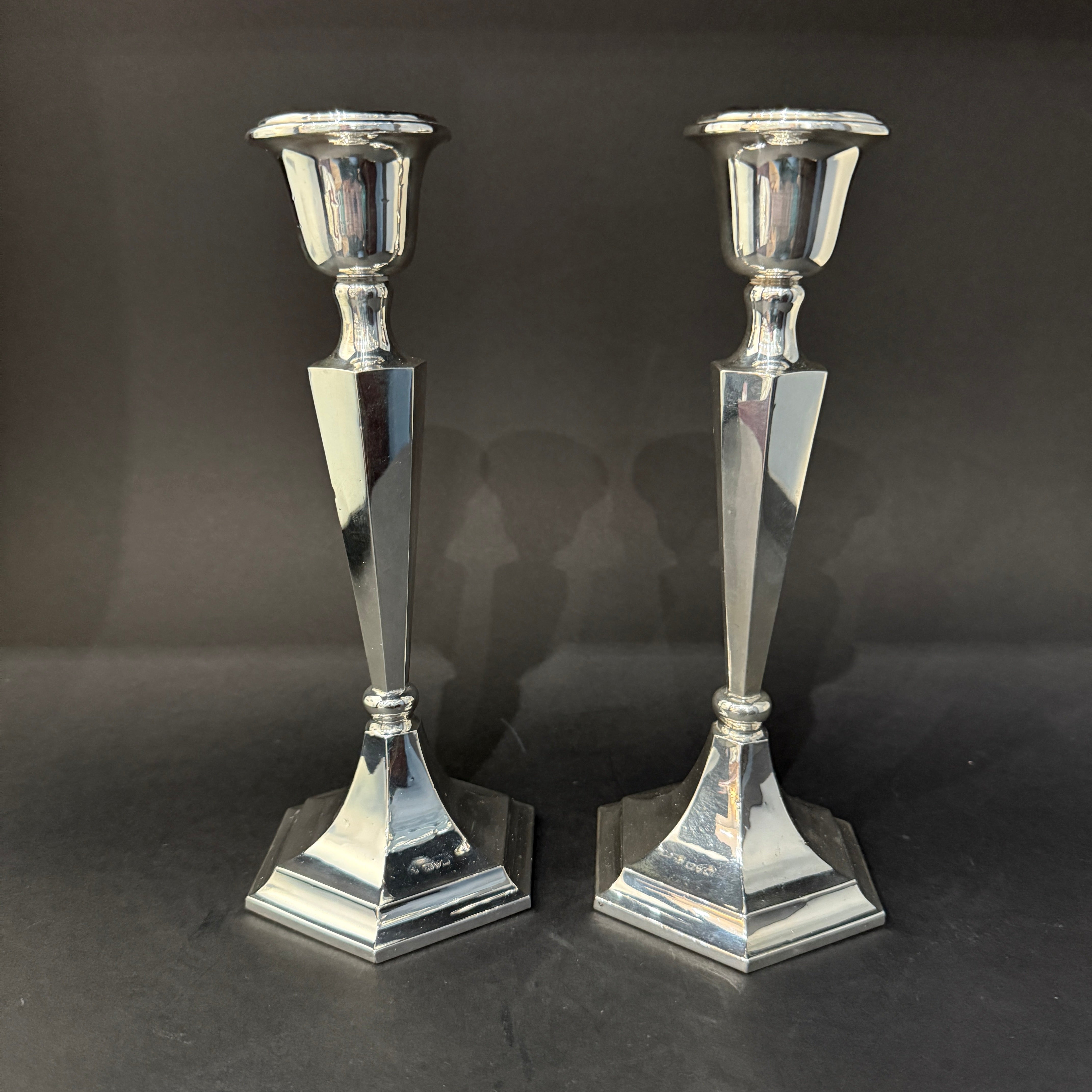 Pair of silver candlesticks on six-sided base made in chester 1923 by James Deacon and Son