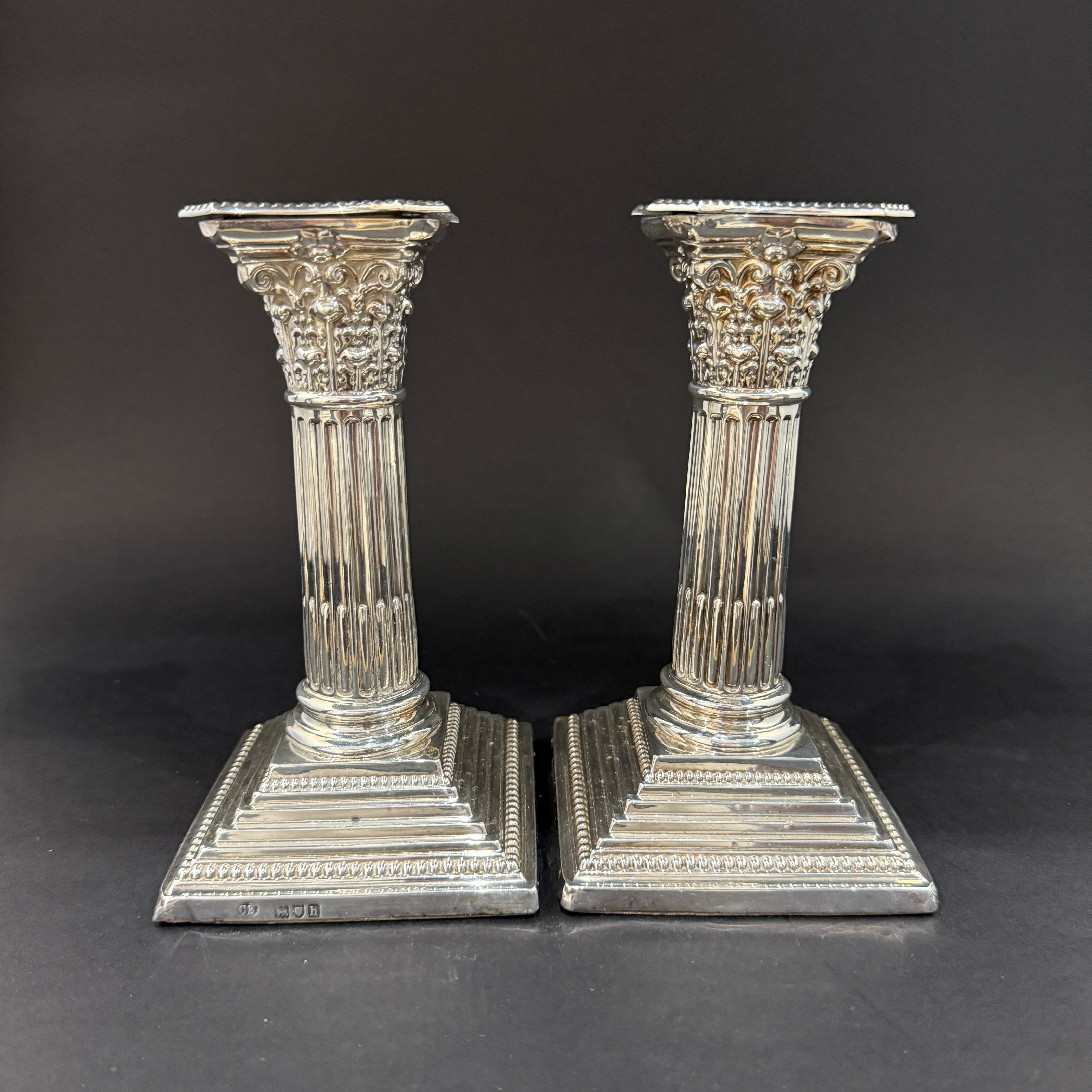 pair of silver candlesticks by Charles Boynon