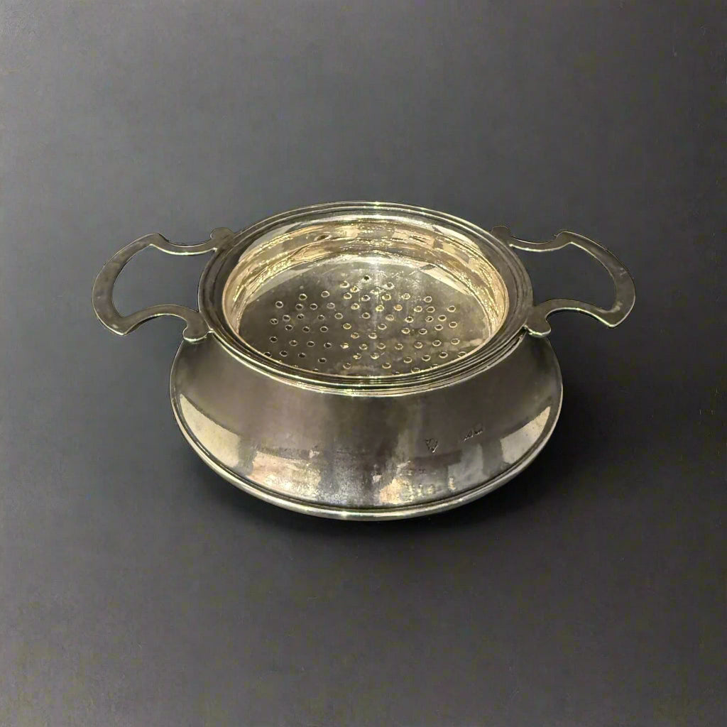 Silver tea and lemon strainer made in Birmingham 1946 by JB Chatterley and Co