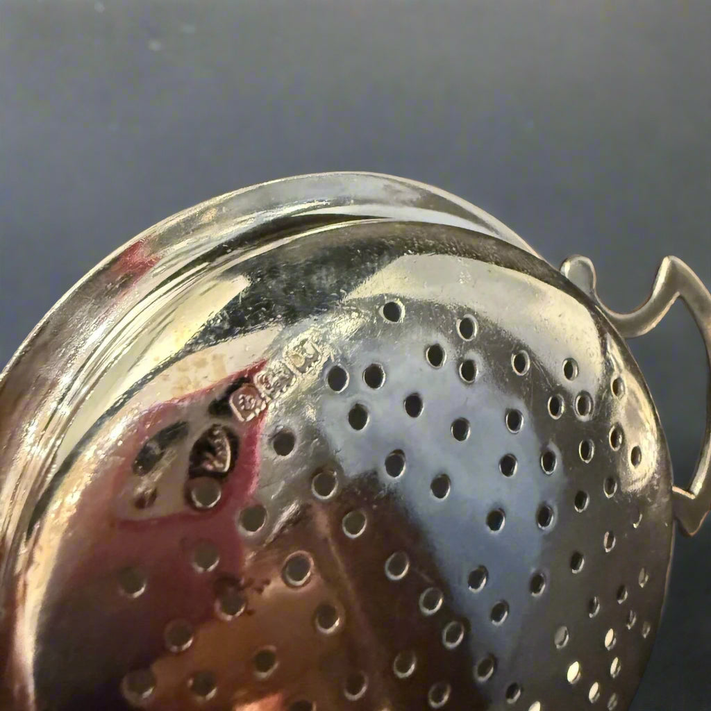 Silver tea and lemon strainer made in Birmingham 1946 by JB Chatterley and Co