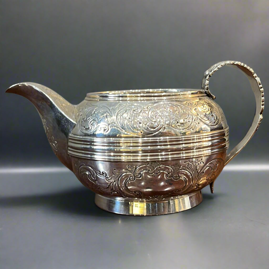 Silver cream jug with enclosed spout and gilt interior made in London 1824