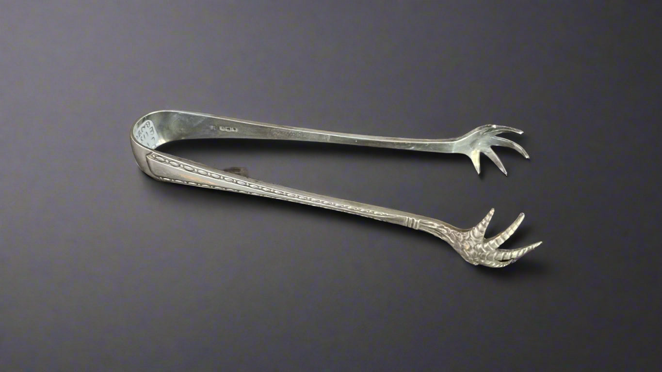 silver ice tongs with claws