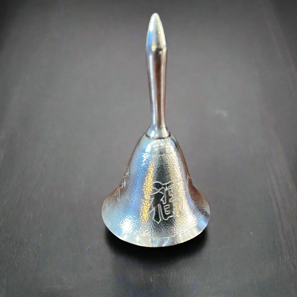 ⁠Hand beaten silver bell with Chinese characters made in Hong Kong circa 1950 by Wai Kee