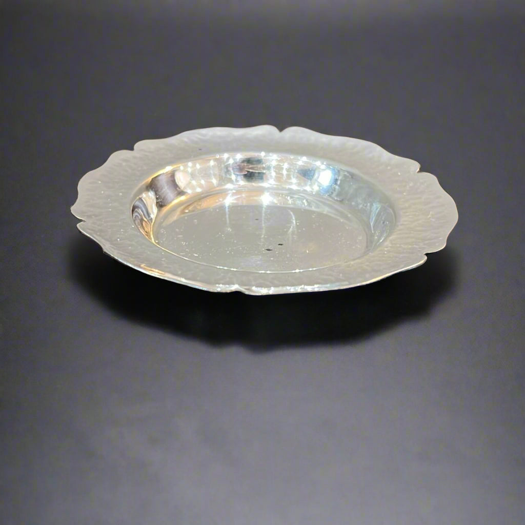 ⁠Small hand beaten silver dish from Peru circa 1950