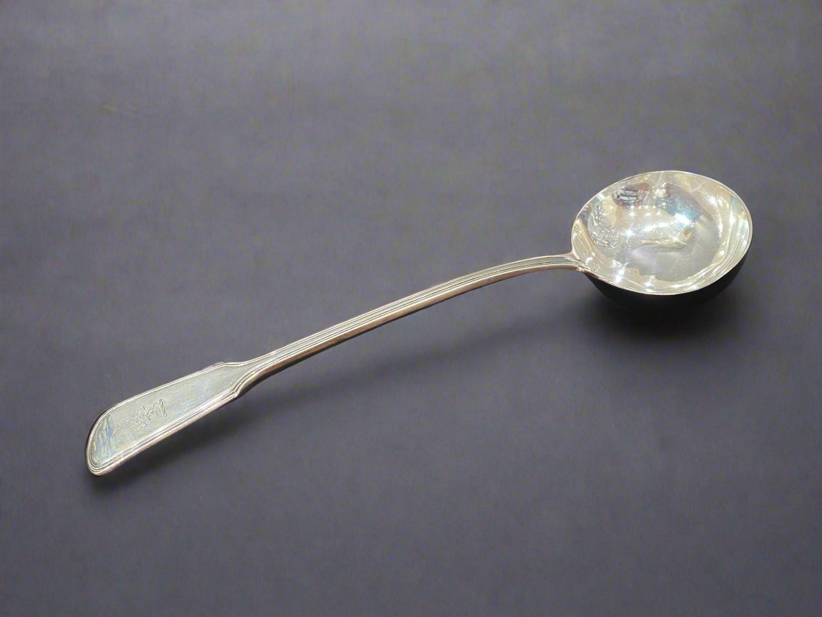 heavy silver soup ladle