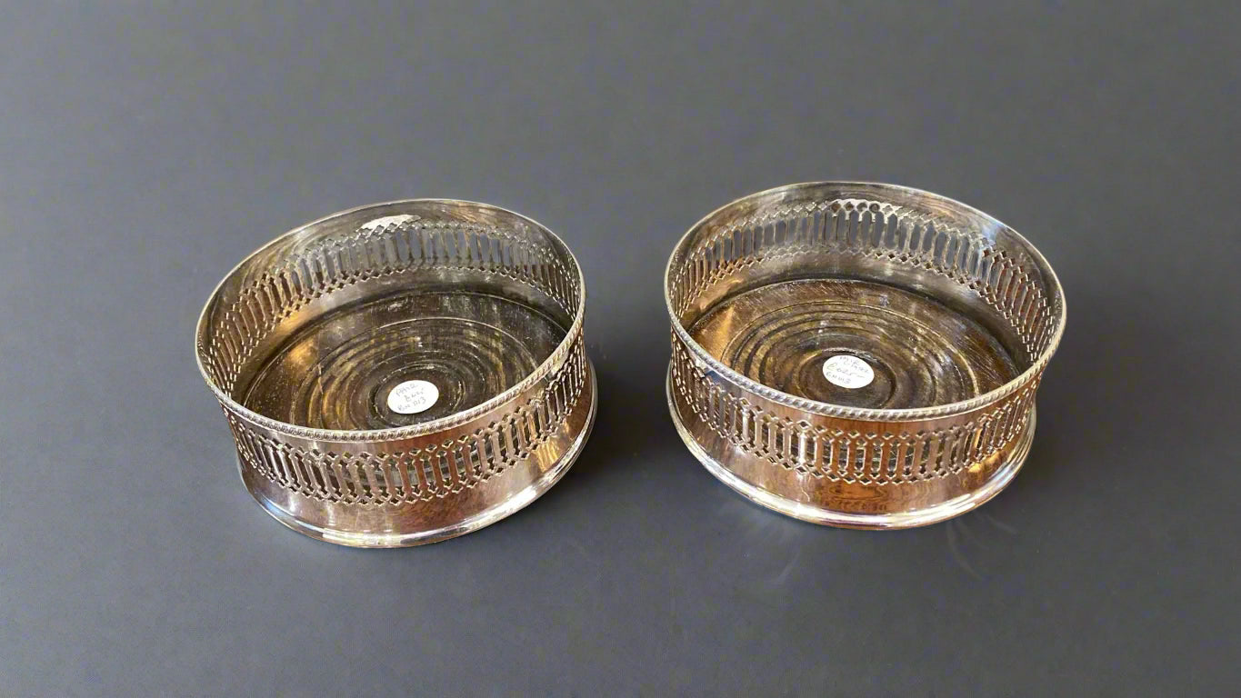 pair of silver wine coasters