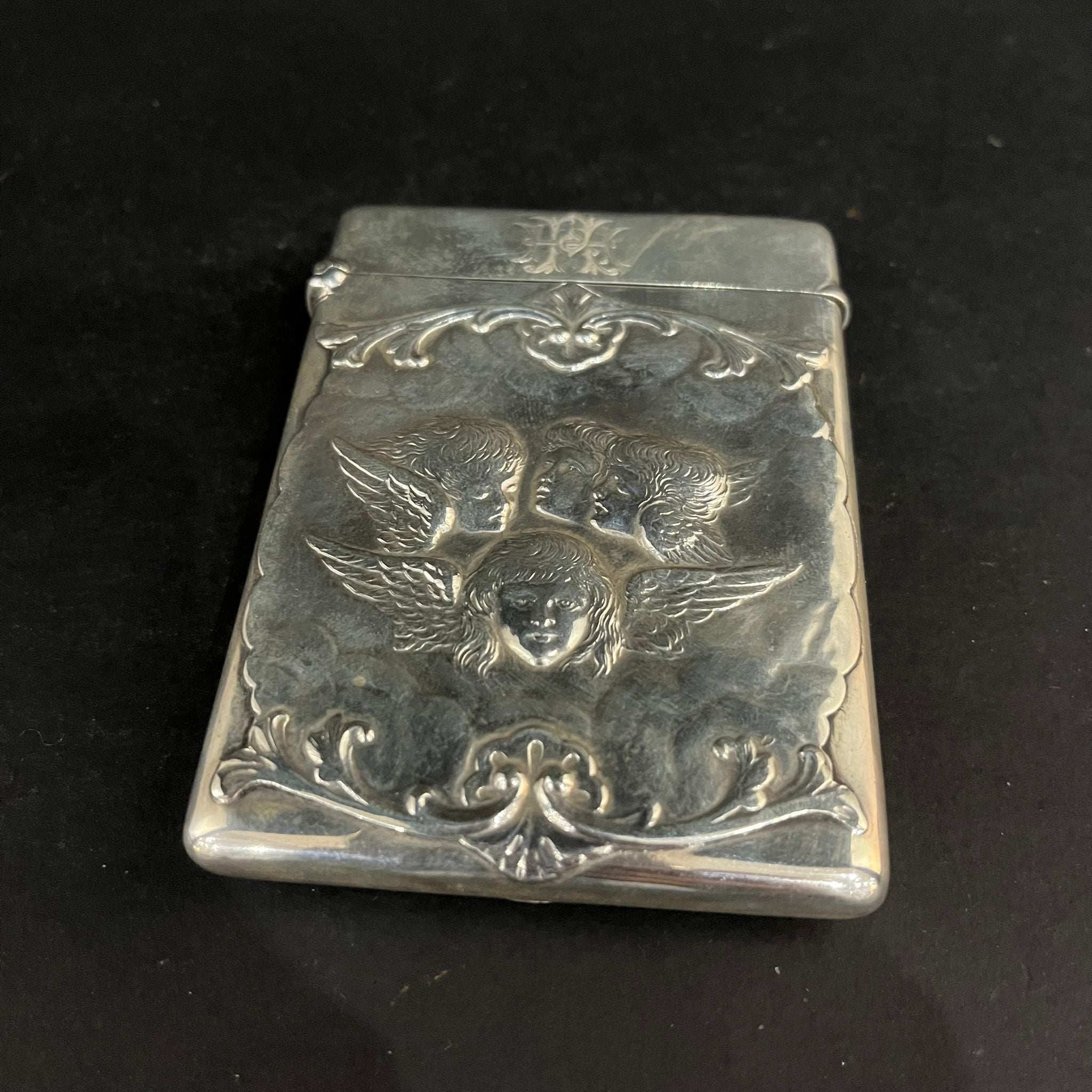 Silver card case with Reynolds Angels made in London 1899 by William Comyns